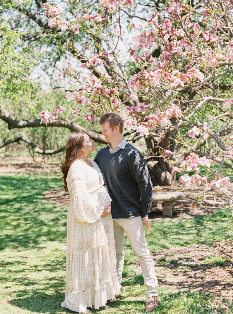 spring maternity photos with magnolia tree in Madison WI
