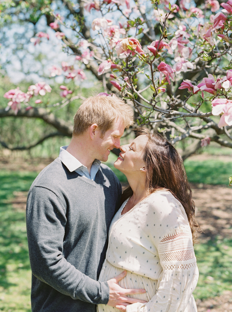 spring maternity photos with magnolia tree in Madison WI