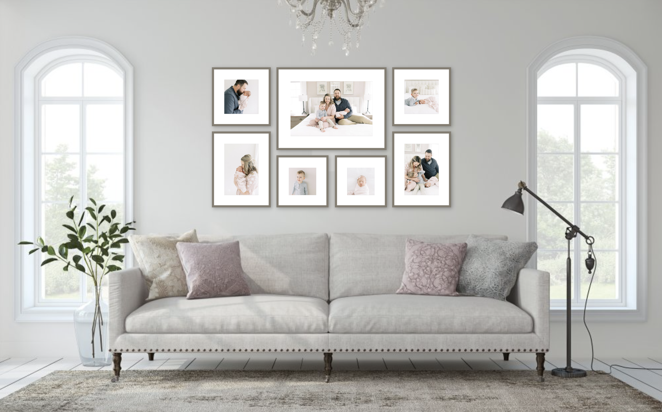 milwaukee family photographer displays framed family photographs behind a white sofa 