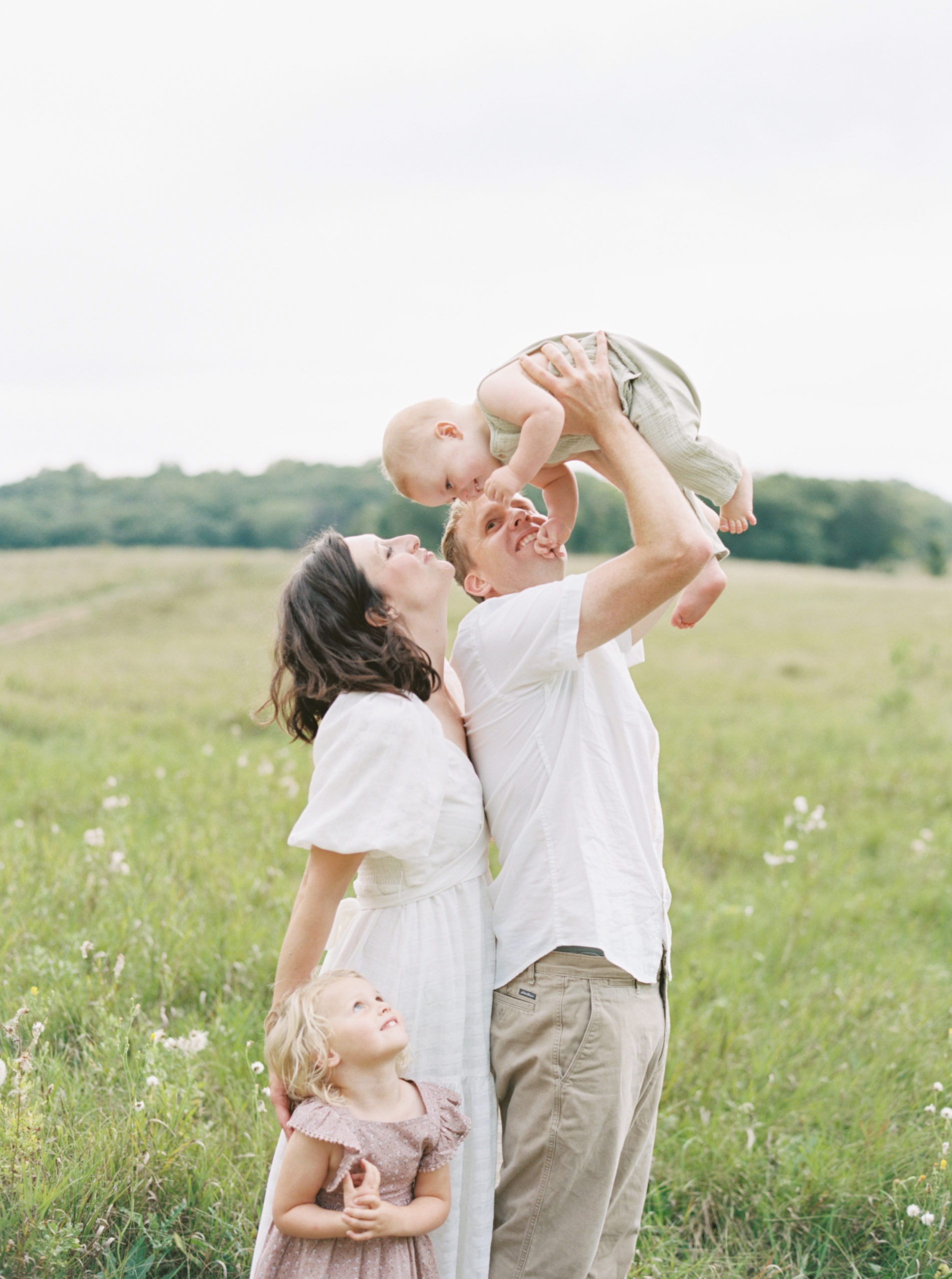 family portrait in a grassy green field setting in Milwaukee in the summer