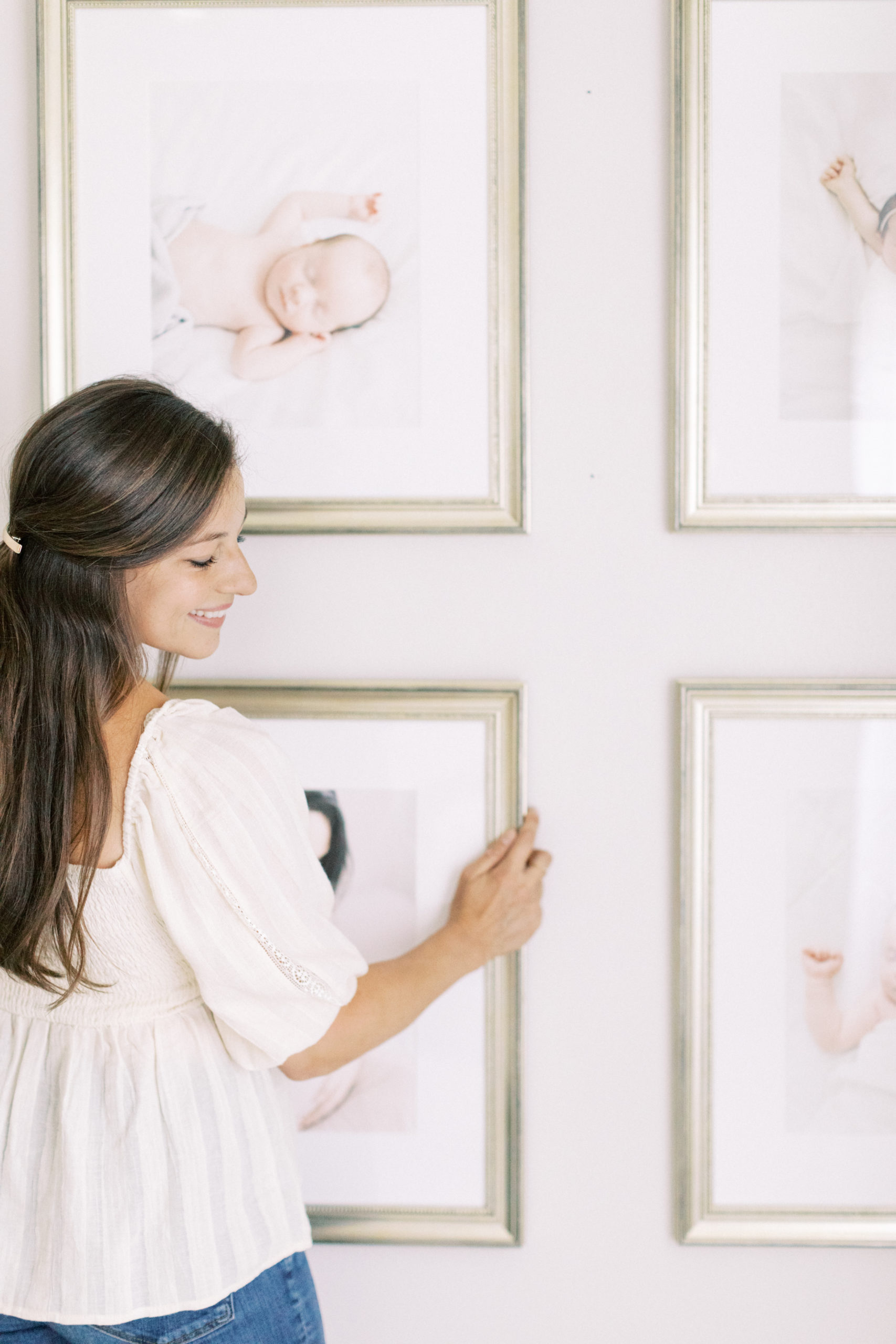 milwaukee newborn photographer holding custom framing portrait