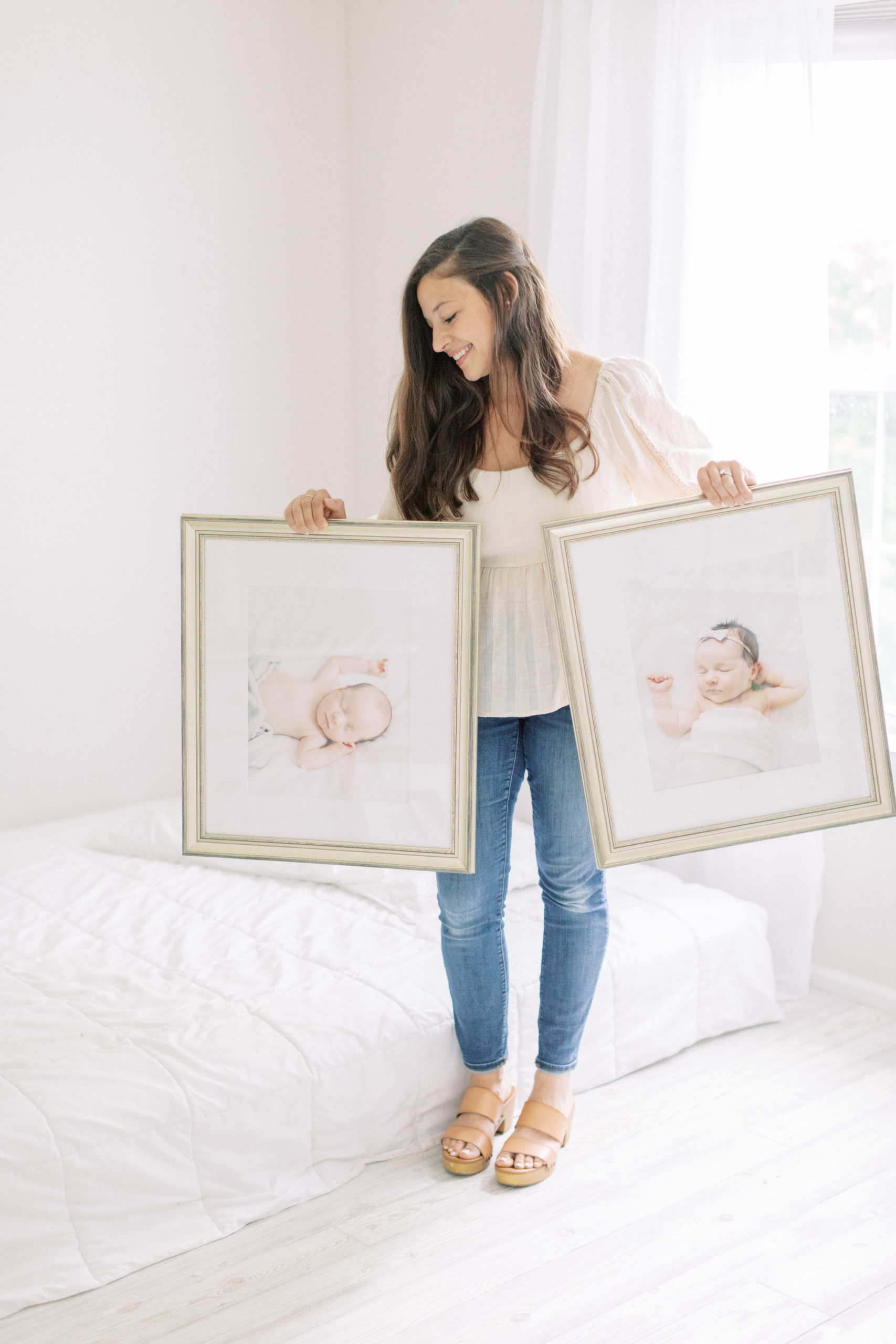milwaukee newborn photographer holding custom framing