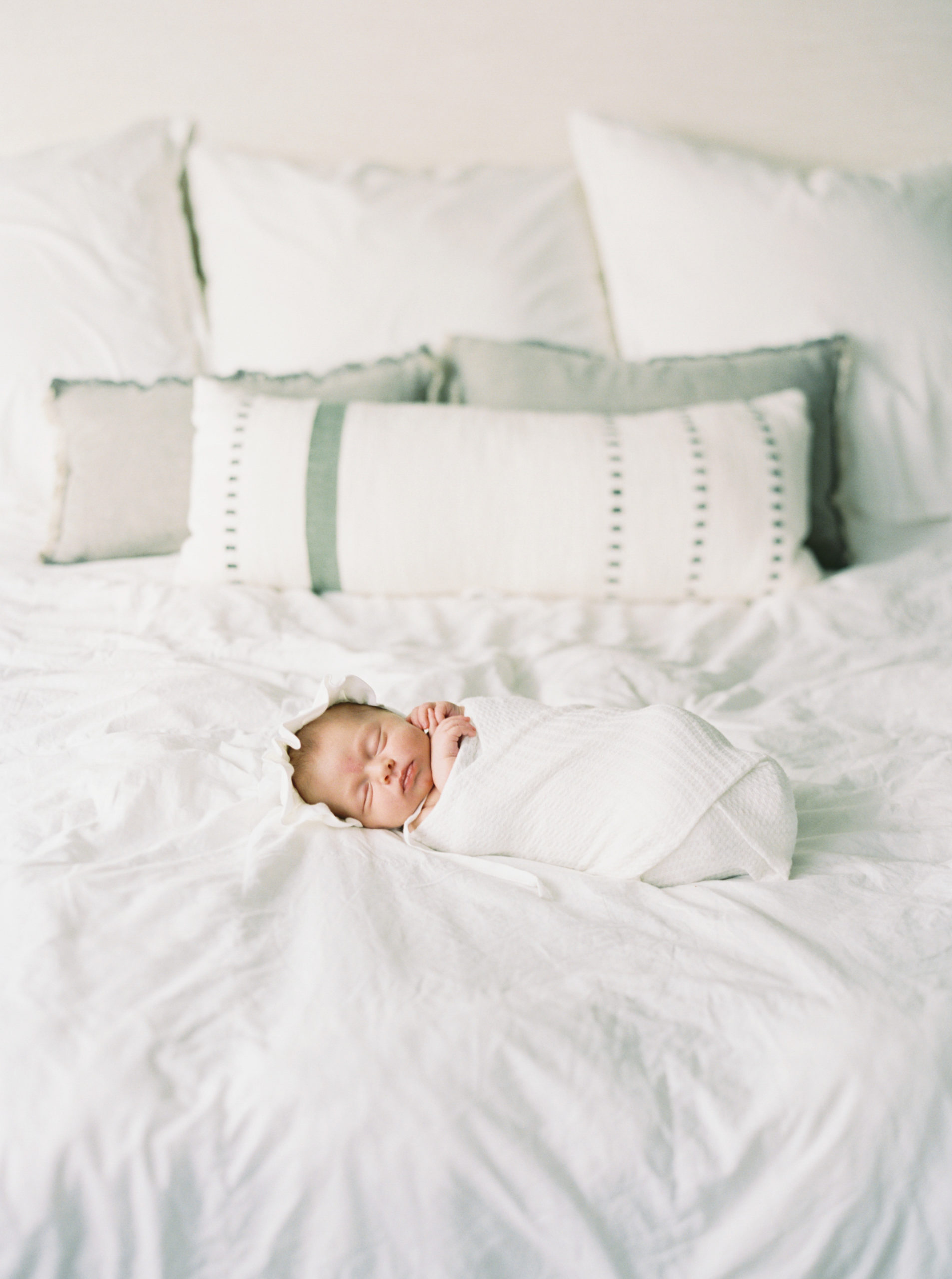 Baby napping in a beautiful, bright, Milwaukee bedroom