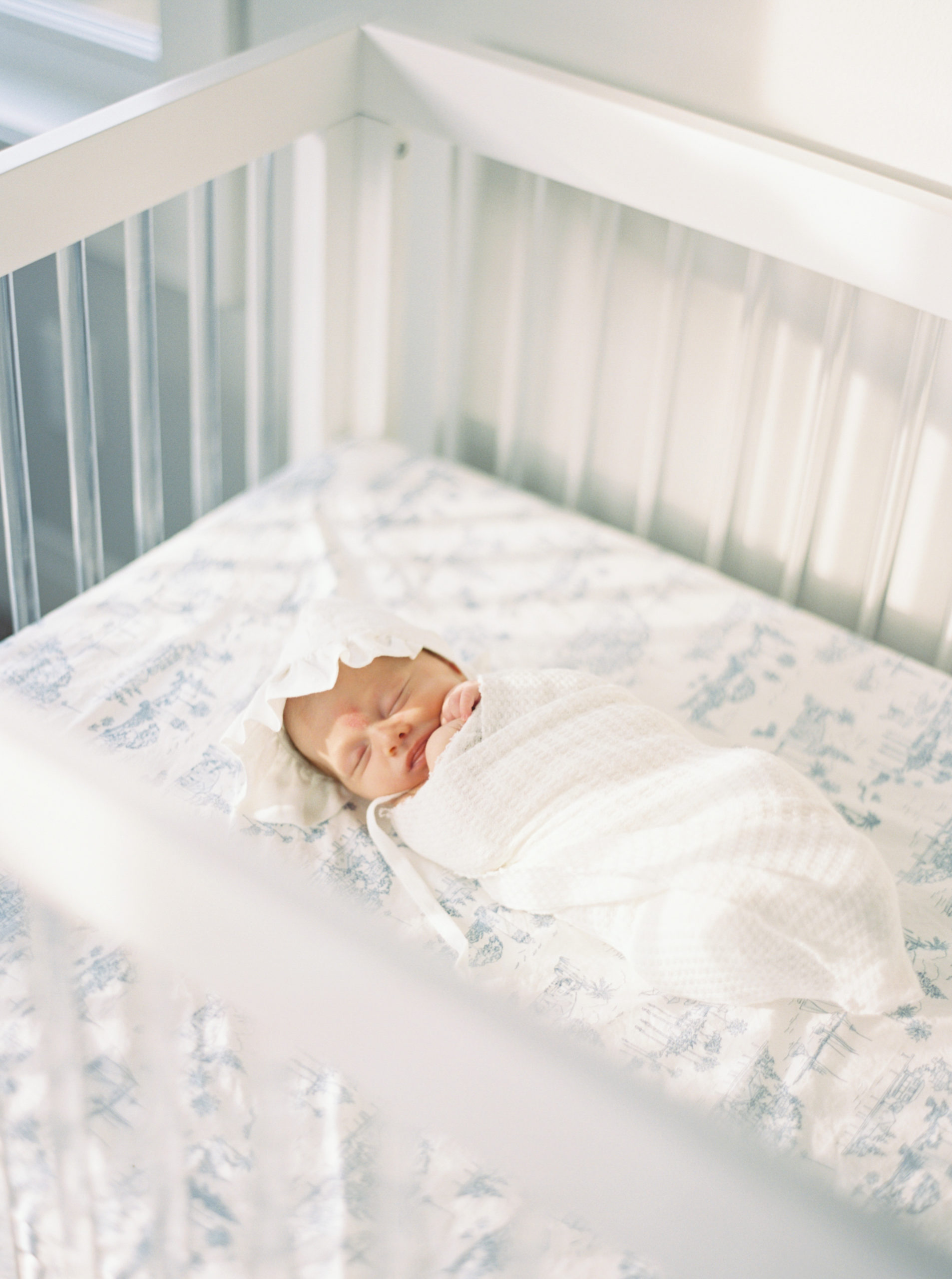 Baby napping in a beautiful, bright bedroom