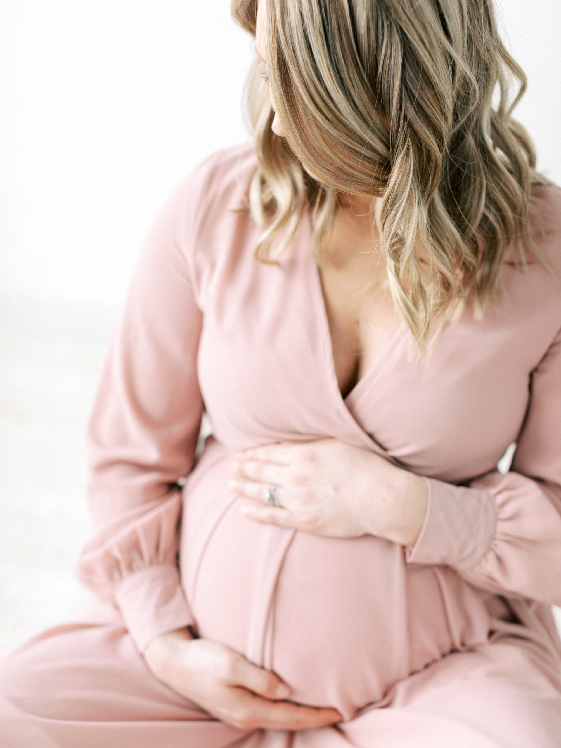 pregnant mother in beautiful pink dress taken by Milwaukee Maternity photographer, Talia Laird Photography