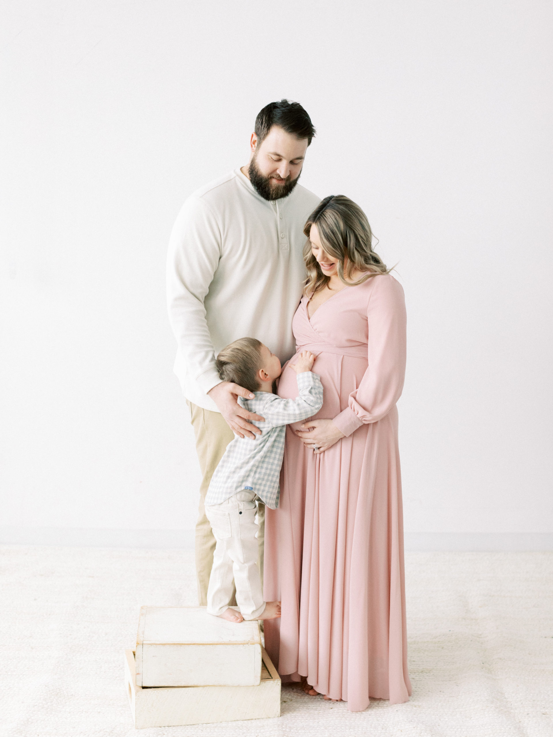 pregnant mother in beautiful pink dress taken by Milwaukee Maternity photographer, Talia Laird Photography