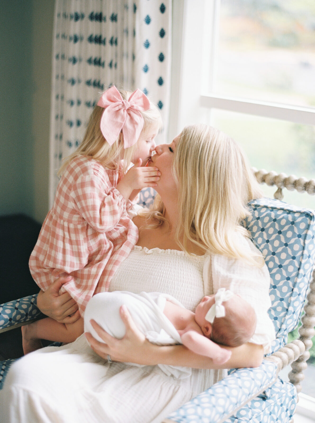 mom and her two daughters photographed together in their home in Milwaukee, wi by Talia Laird Photography